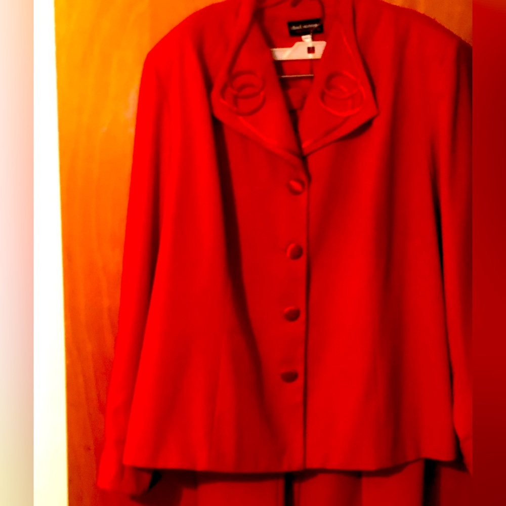 2 piece Red suit with satin trim on  collar, cuffs with satin buttons.